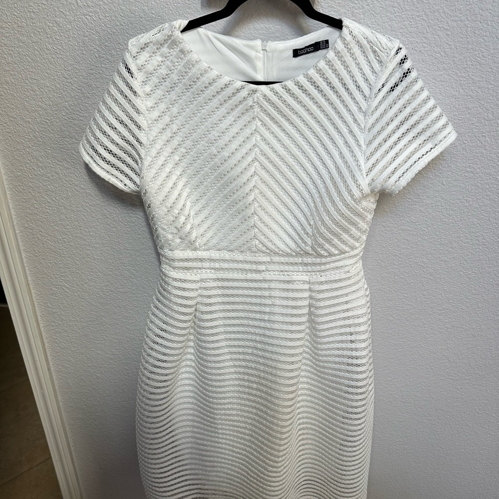 Cute white Boohoo midi dress.  With lace style holes